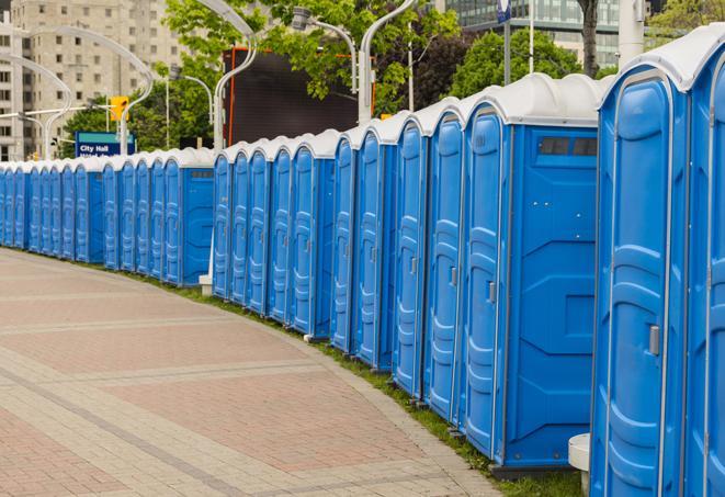 colorful portable restrooms available for rent at a local fair or carnival in Agua Dulce